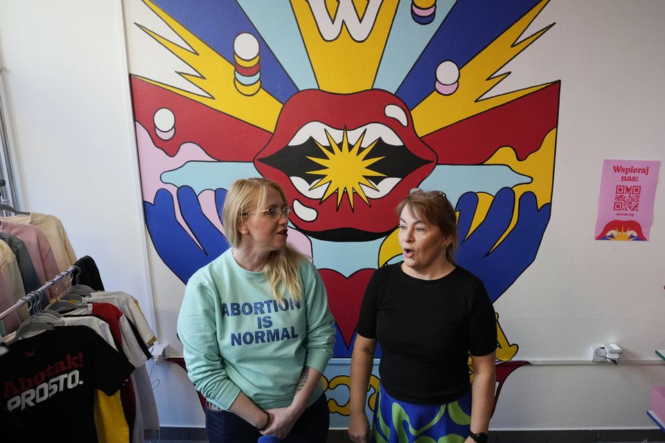 Abortion rights activists at a centre where women can have abortions with pills, either alone or with other women, in Warsaw (Czarek Sokolowski/AP)