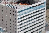 thumbnail: Black smoke raises from a building during a fire in Tokyo after one of the largest earthquakes on record slammed Japan's eastern coasts Friday, March 11, 2011