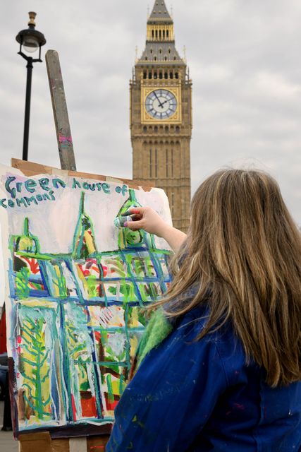 Emily Powell paints outdoors in front of the Winston Churchill sculpture in Parliament Square (Doug Peters/PA)