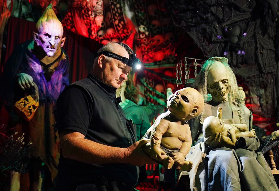 Electrician Ken Carraher continues preparations on his Halloween House of Horrors in Killiney, Dublin (Brian Lawless/PA)