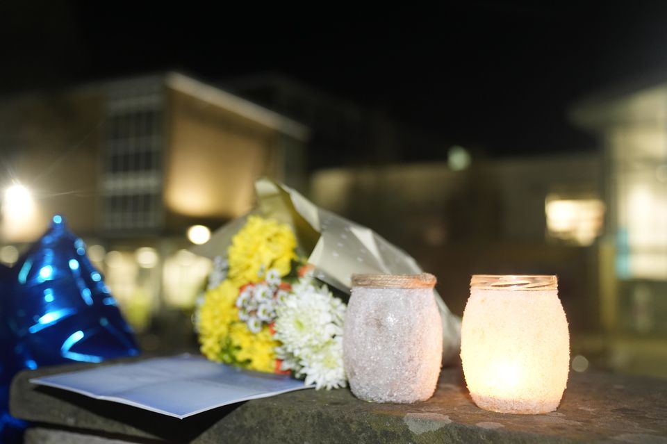 Tributes left outside All Saints Catholic High School on Monday night (Danny Lawson/PA)