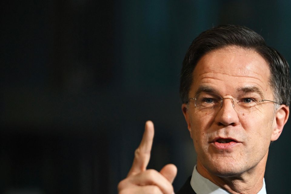 Nato secretary general Mark Rutte speaks with the media as he arrives for a meeting of Nato defence ministers in Brussels (Harry Nakos/AP)