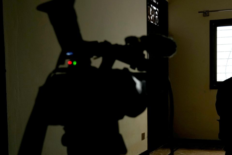 An Afghan refugee man, who asked not to show his face fearing his identity could lead to his capture, speaks during an interview in Islamabad (Anjum Naveed/AP)