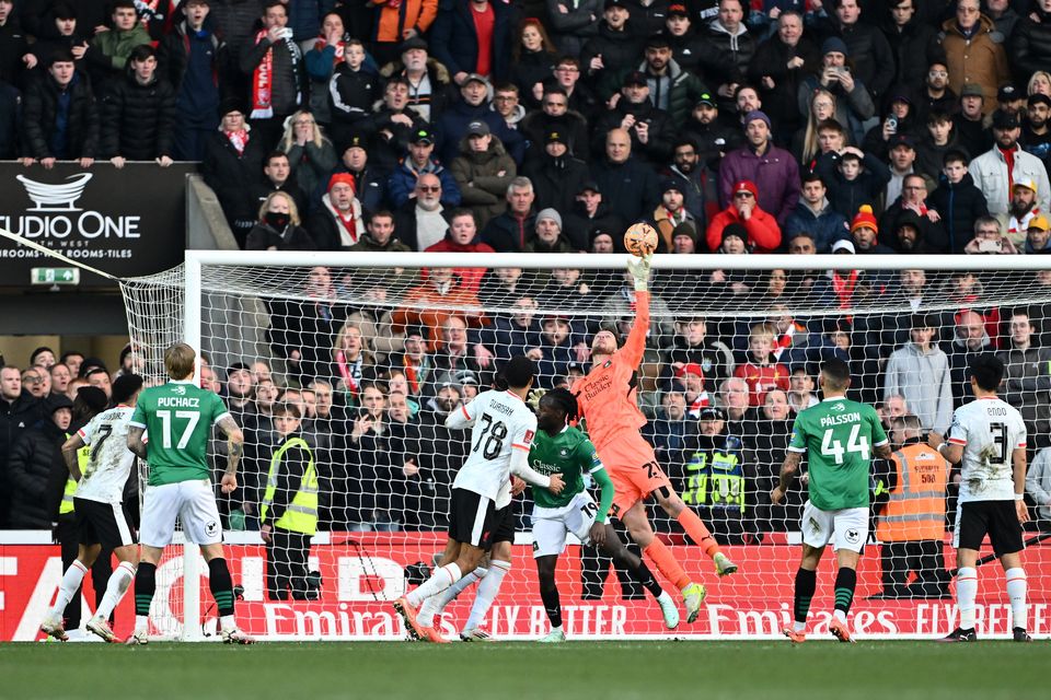 Conor Hazard of Plymouth Argyle makes a save against Liverpool