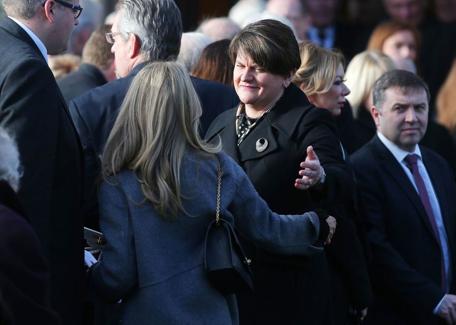 Dr Adamson's wife Kerry is comforted after the funeral service by DUP leader Arlene Foster. 
Picture by Jonathan Porter/PressEye