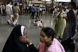 thumbnail: Passengers wait for their respective trains at Chhatrapati Shivaji railroad station, where the terror attacks began on Wednesday with shooters spraying gunfire,  in Mumbai, India, Saturday, Nov. 29, 2008. Indian commandos killed the last remaining gunmen holed up at a luxury Mumbai hotel Saturday, ending a 60-hour rampage through India's financial capital by suspected Islamic militants that killed people and rocked the nation. (AP Photo/Altaf Qadri)