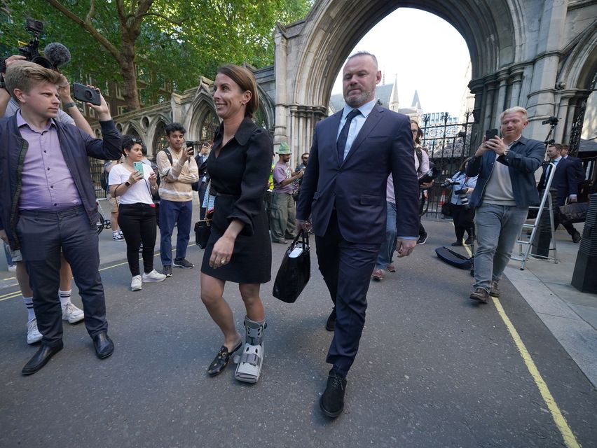 Coleen and Wayne Rooney leaves the Royal Courts Of Justice after a hearing in 2022 (PA)