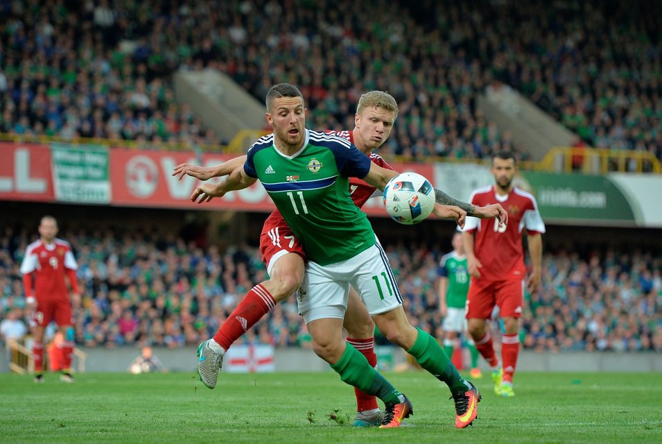 BELFAST, NORTHERN IRELAND - MAY 27: Conor Washington (L) of Northern Ireland and Mikita Korzun (R) of Belarus during the international friendly game between Northern Ireland and Belarus on May 26, 2016 in Belfast, Northern Ireland. (Photo by Charles McQuillan/Getty Images)