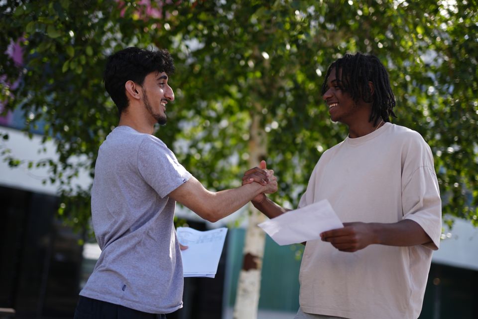 Students embraced and congratulated each other on their results (Jordan Pettitt/PA)