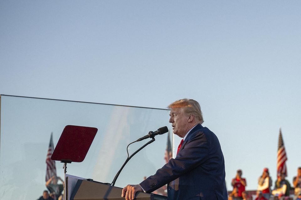 TOPSHOT - Tesla CEO Elon Musk (R) jumps on stage as he joins former US President and Republican presidential candidate Donald Trump during a campaign rally at site of his first assassination attempt in Butler, Pennsylvania on October 5, 2024. (Photo by Jim WATSON / AFP) (Photo by JIM WATSON/AFP via Getty Images)