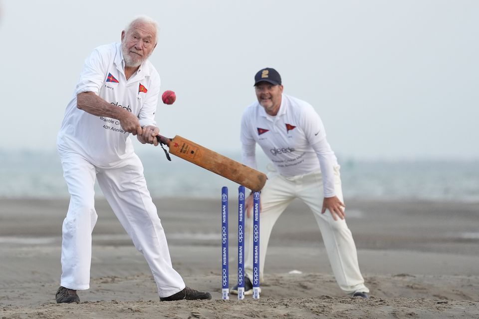 Sir Robin Knox-Johnston (left) bats during the annual Brambles cricket match (Andrew Matthews/PA)