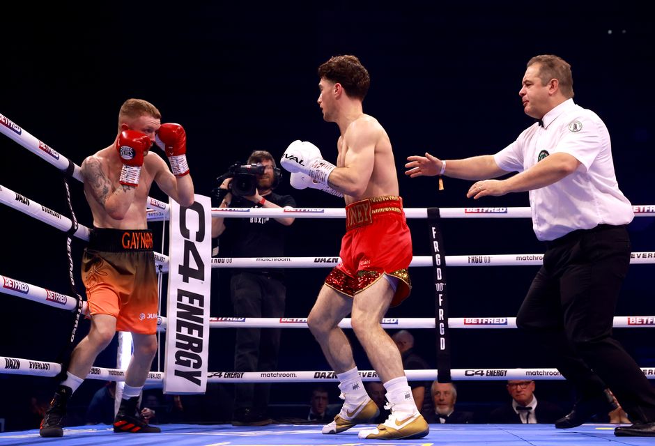 John Cooney, in the gold boots, in action in an earlier fight (Liam McBurney/PA)