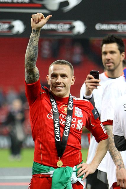 Craig Bellamy celebrates after winning the League Cup at Liverpool in 2012 (Nick Potts/PA)