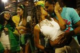 thumbnail: RIO DE JANEIRO, BRAZIL - JUNE 23:  A couple kisses after Brazil defeated Cameroon during celebrations along Copacabana Beach on June 23, 2014 in Rio de Janeiro, Brazil. Brazil won the match 4-1.  (Photo by Mario Tama/Getty Images)