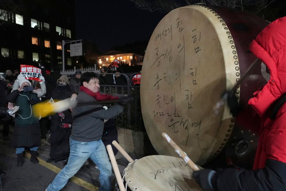 Supporters of impeached South Korean President Yoon Suk Yeol stage a rally to oppose a court warrant to detain him (Lee Jin-man/AP)