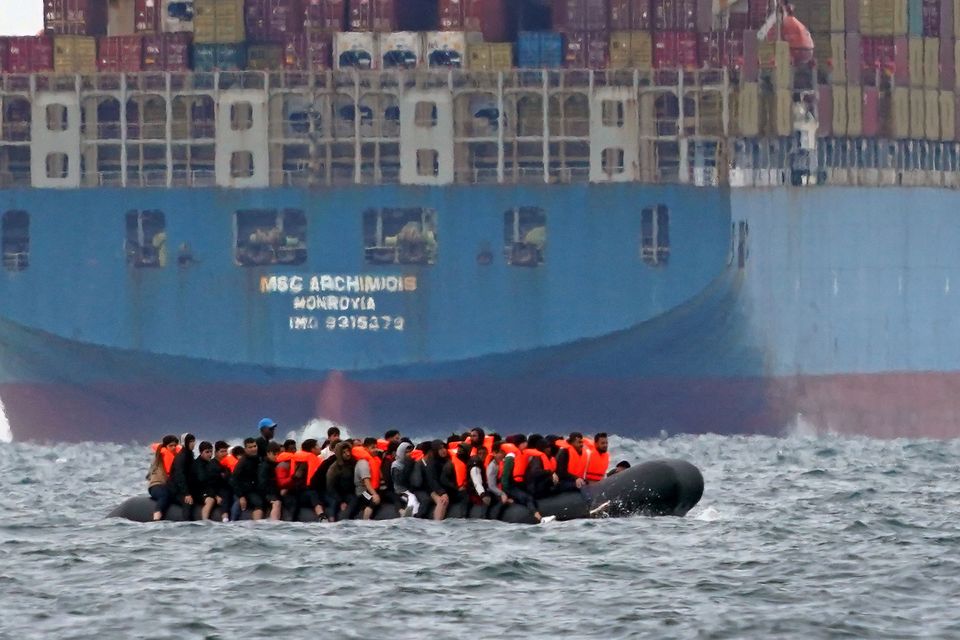 A group of people thought to be migrants crossing the Channel in a small boat (Gareth Fuller/PA)