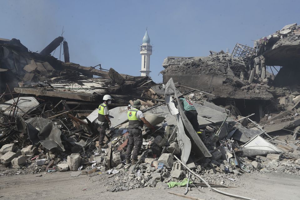 Rescue workers search for victims in the rubble of destroyed buildings in Lebanon (Mohammed Zaatari/AP)