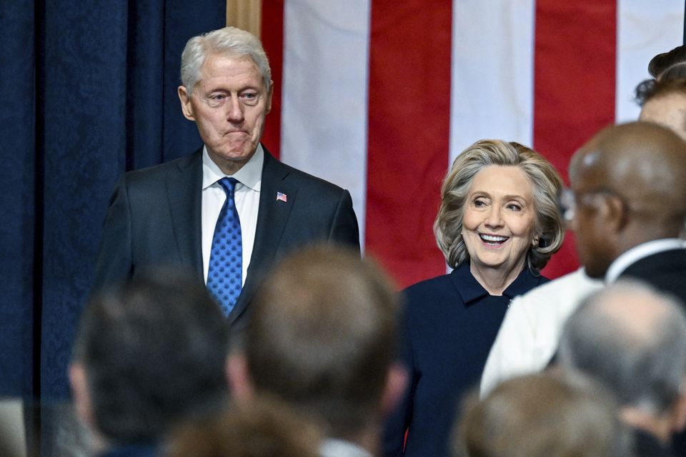 Hillary and Bill Clinton arrive (Kenny Holston/The New York Times via AP)