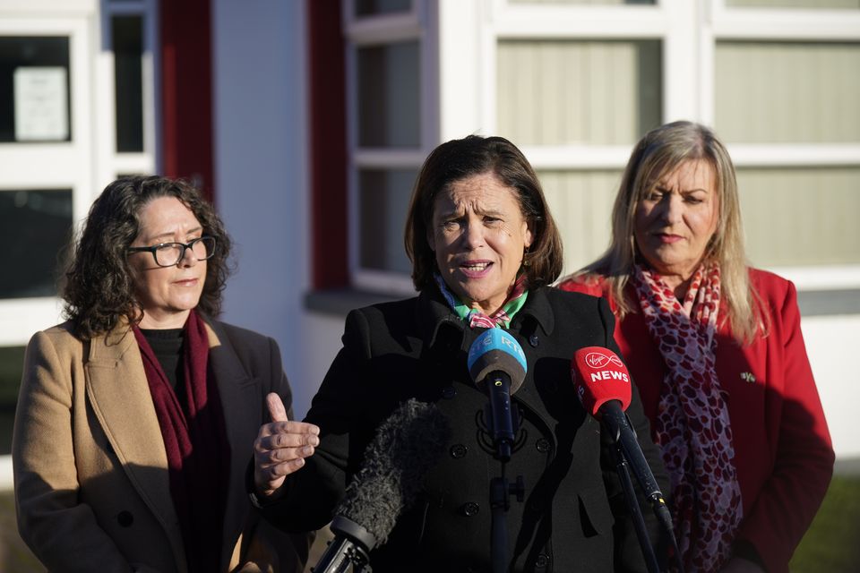 Sinn Fein leader Mary Lou McDonald (centre) speaks to the media at Naas Fire Station (Niall Carson/PA)