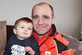 thumbnail: Hero postman Darren Dixon with little Caleb Campbell