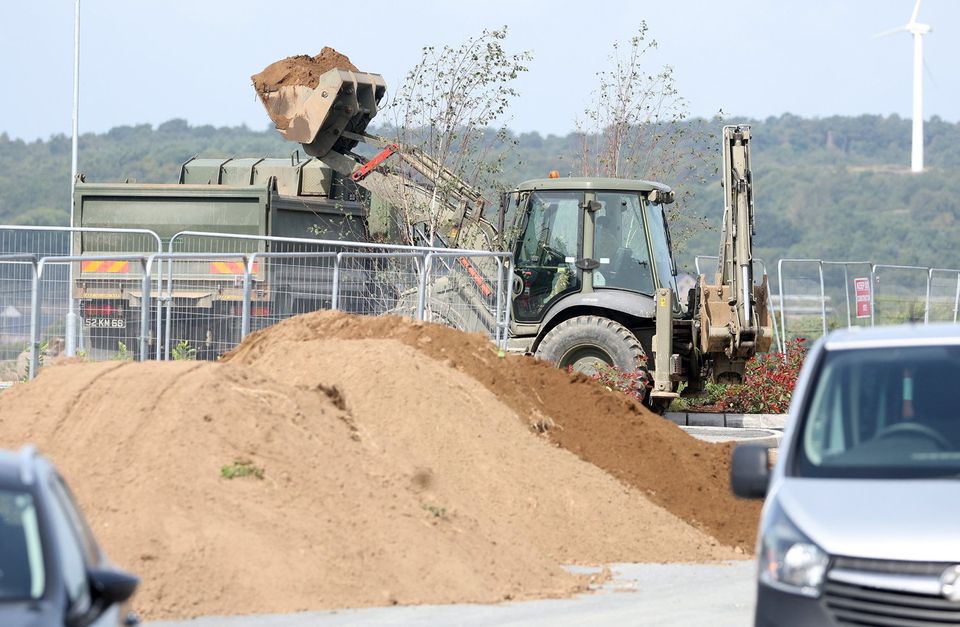 Army and police deal with a suspected World War Two bomb which was discovered on a building site in the the Rivenwood housing development area of Newtownards, Co. Down. Picture by Jonathan Porter/PressEye