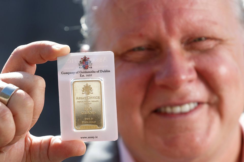 Nigel Doolin, Head of Trading at Core Bullion Traders, pictured with one of the Dublin Assay Office gold bullion bars (Conor McCabe Photography)