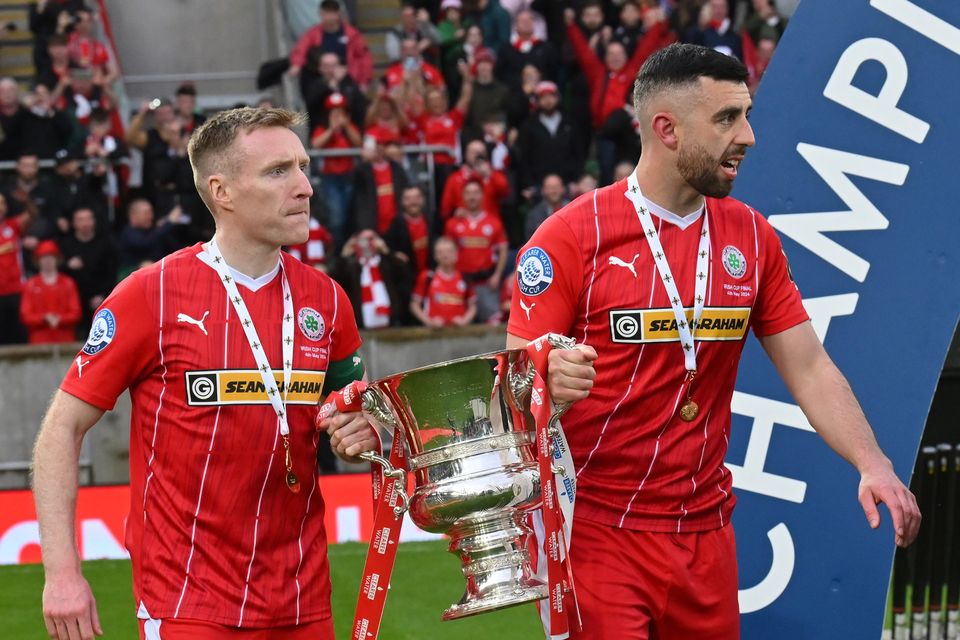 Cliftonville captain Chris Curran and club legend Joe Gormley lifted the Irish Cup together