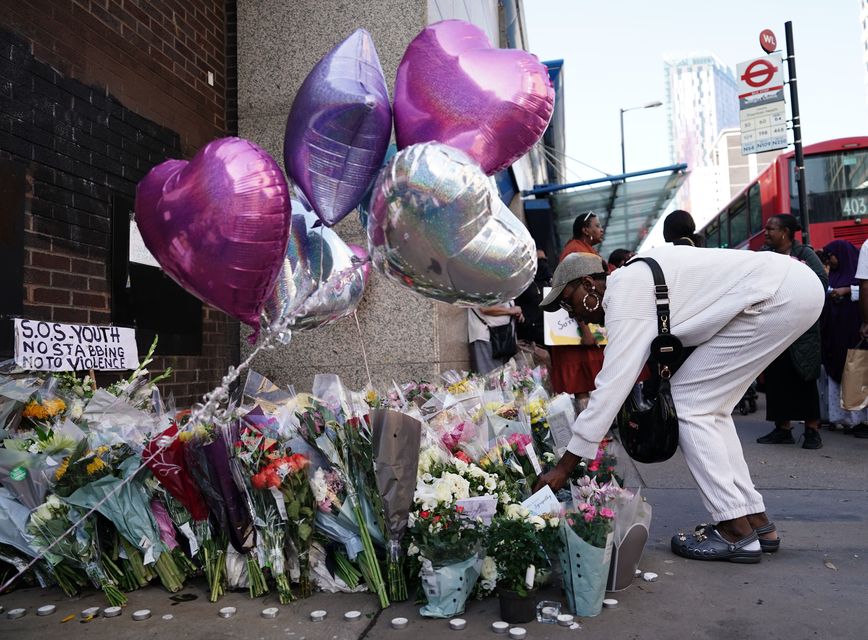 Flowers and tributes at the scene in Croydon, south London, where Elianne Andam died (Jordan Pettitt/PA)