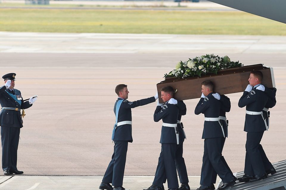 The coffin of  John Stollery is taken from the RAF C-17 carrying the bodies of eight British nationals killed in the Tunisia terror attack at RAF Brize Norton in Oxfordshire. PRESS ASSOCIATION Photo. Picture date: Wednesday July 1, 2015. The bodies of eight Britons killed by the gunman will be returned to the UK today. It comes as the names of two more people who died in the attack emerged, following a statement from their family. The first RAF flights left Britain early this morning and will carry the bodies back to Brize Norton, with the repatriation process expected to take a number of days. See PA story POLICE Tunisia. Photo credit should read: Joe Giddens/PA Wire