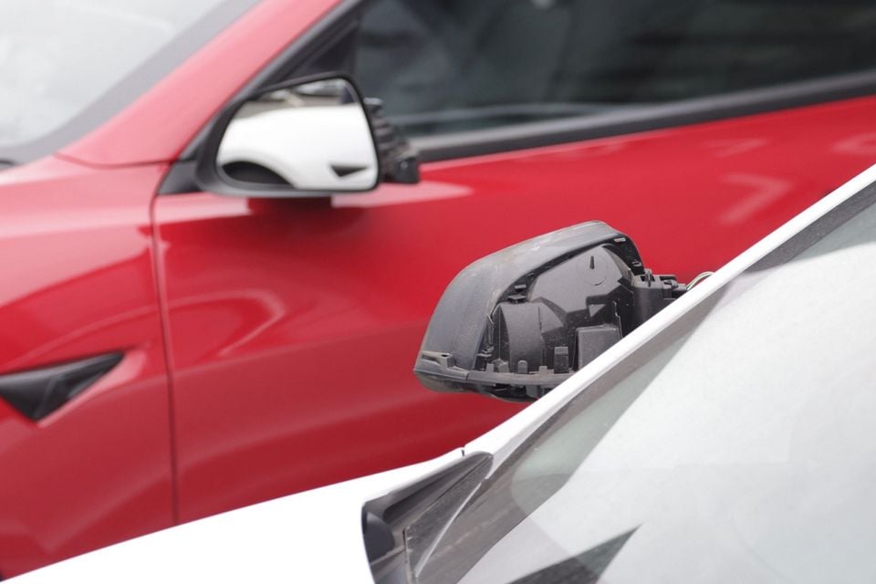 Around 20 cars were damaged at a Tesla dealership in Belfast. Photo by Pacemaker
