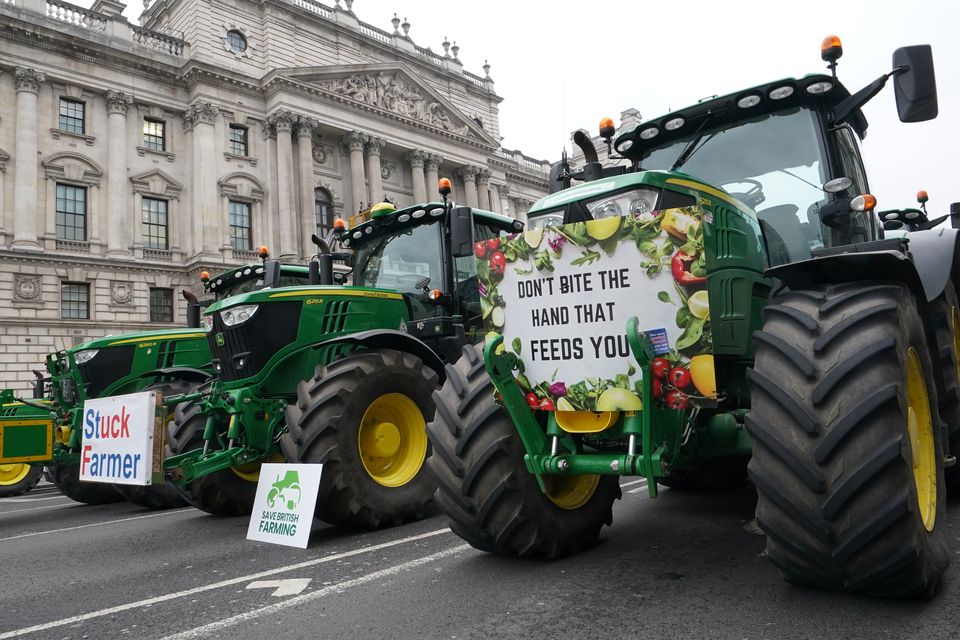 Farmers and their tractors descended on Parliament Square in further protests against new tax rules (Gareth Fuller/PA)