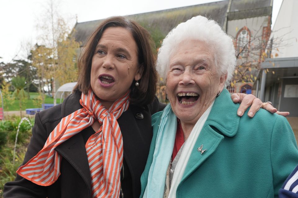 Sinn Fein leader Mary Lou McDonald (left) is greeted by Sarah Byrne (right) as she arrives to cast her vote at Deaf Village Ireland on Navan Road (Brian Lawless/PA)