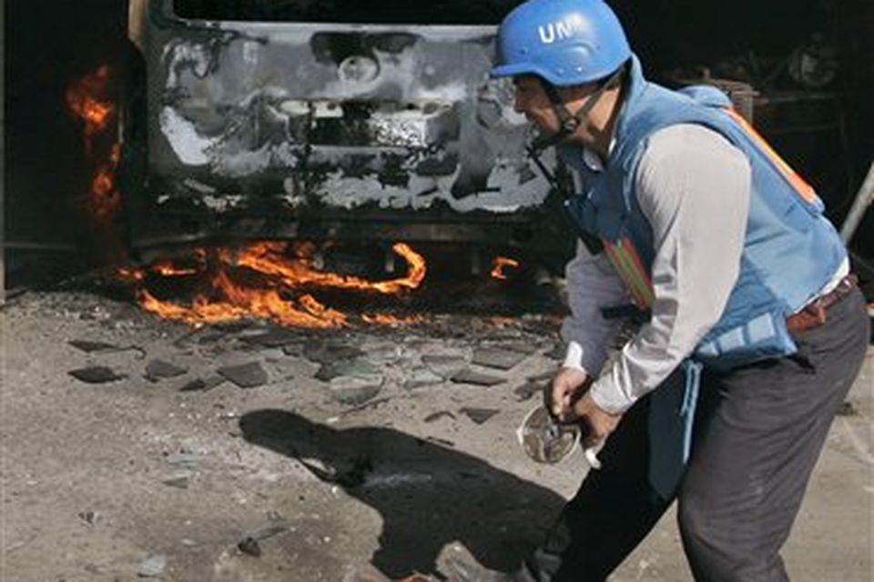 A United Nations worker surveys the damage from Israeli bombardment at the United Nations headquarters in Gaza City, Thursday, Jan. 15, 2009. Witnesses and U.N. officials said that Israeli shells struck the United Nations headquarters in Gaza City.The U.N. chief Ban Ki-moon has expressed "strong protest and outrage" to Israel over the shelling of the compound. (AP Photo/Hatem Moussa)