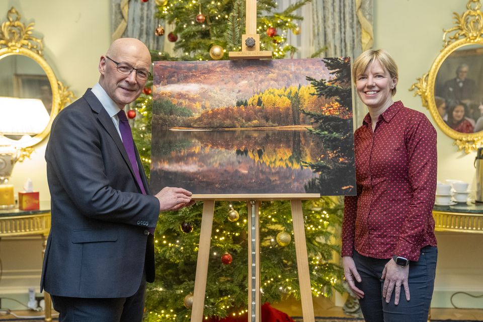 John Swinney and PA news agency photographer Jane Barlow at the launch of the First Minister’s official Christmas card (Lesley Martin/PA)