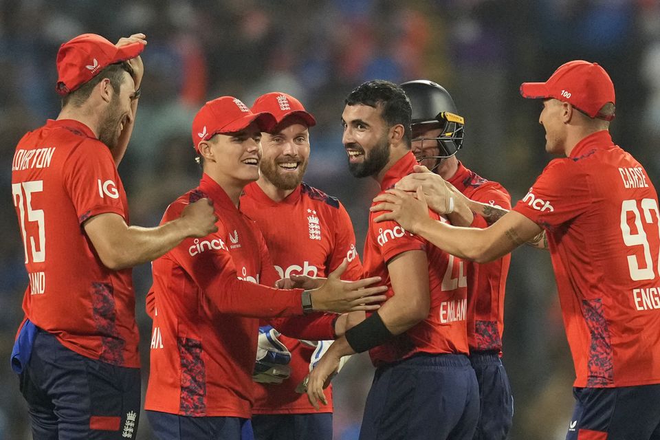 Saqib Mahmood, centre, was the pick of the England attack (Rafiq Maqbool/AP)