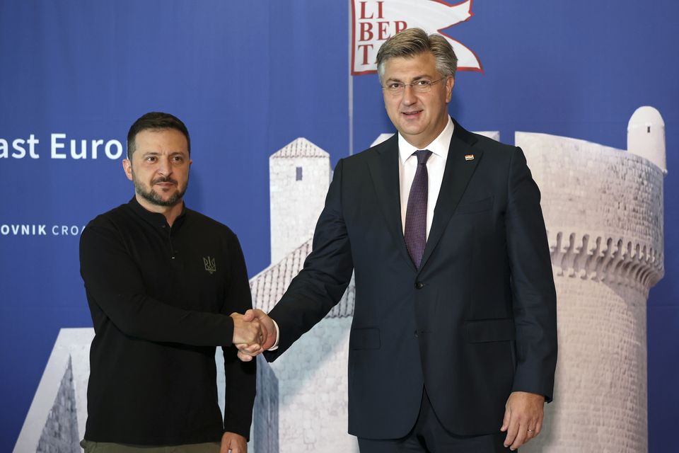 Ukrainian President Volodymyr Zelensky was welcomed by Croatian Prime Minister Andrej Plenkovic in Dubrovnik (Pool via AP)