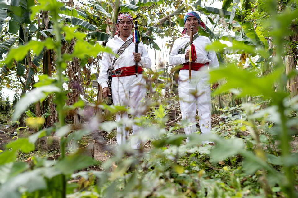 Spiritual leaders Guadalupe de Paz (left) and Emilio Cuxun in the garden at Qachuu Aloom (Mother Earth) in Rabinal, in the Baja Verapaz region of Guatemala (Brian Lawless/PA)