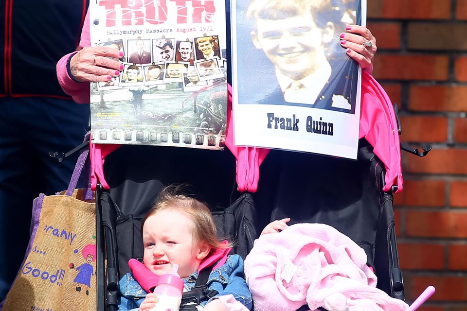 Protestors await the arrival of Prince Charles and Camilla at St Patrick's Church, Donegall Street, Belfast.