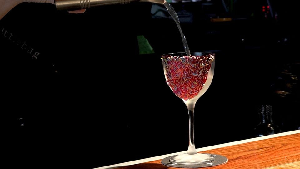 The drink is poured into a glass decorated with - what else? - hundreds and thousands