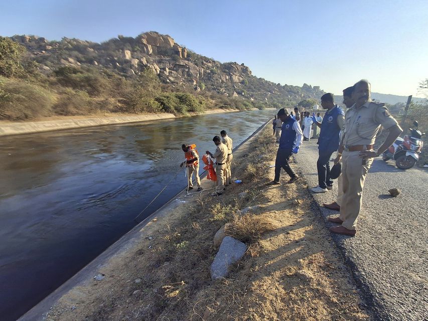 Police search a canal in Karnataka (AP)