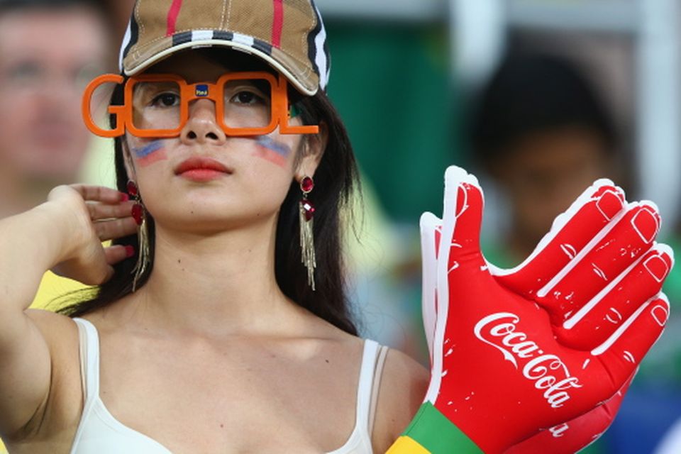 The beautiful game - football fans from around the world -  : A fan looks on during the 2014 FIFA World Cup Brazil Group H match between Russia and South Korea at Arena Pantanal on June 17, 2014 in Cuiaba, Brazil.  (Photo by Adam Pretty/Getty Images)