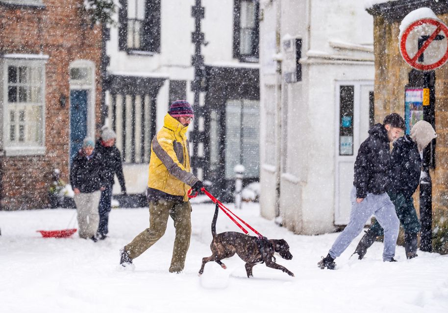 People venture out for a dog walk in North Yorkshire (Danny Lawson/PA)