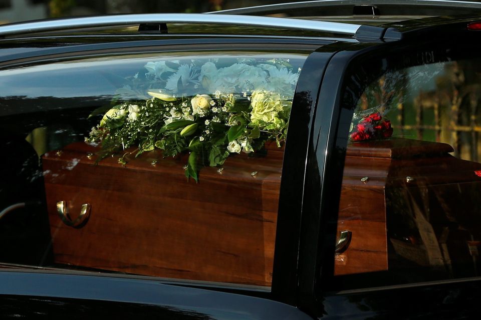 BRIZE NORTON, ENGLAND - JULY 01:  A close-up view of a coffin as a funeral cortege carrying the victims of last Friday's terrorist attack in Tunisia drives through the village of Brize Norton after arriving at the nearby RAF airbase on July 1, 2015 in Brize Norton, England. British nationals Adrian Evans, Charles Evans, Joel Richards, Carly Lovett, Stephen Mellor, John Stollery and Denis and Elaine Thwaites are the first of the victims of last week's terror attack to be repatriated.  (Photo by Dan Kitwood/Getty Images)