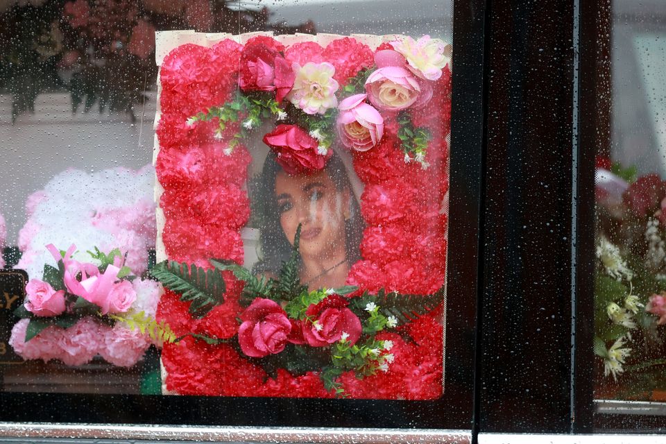 A photo of Chloe Ferris among flowers and other tributes (Liam McBurney/PA)