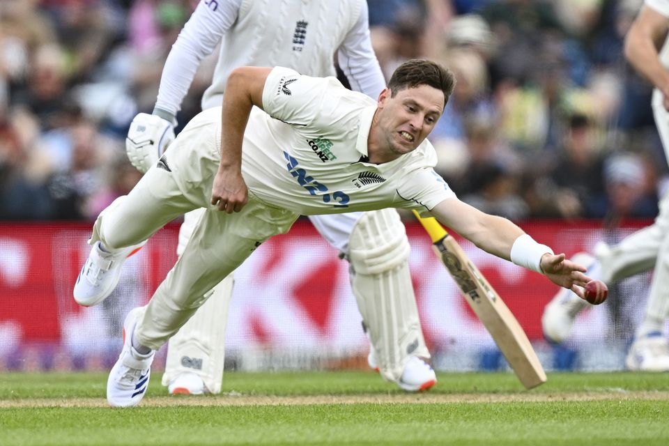 New Zealand’s Matt Henry dives to field the ball (Andrew Cornaga/Photosport/AP)