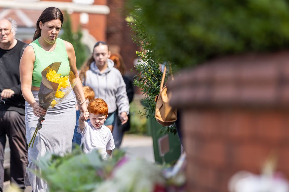 People added to the flora tributes throughout Tuesday (James Speakman/PA)