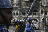 thumbnail: Members of the Rapid Action Force walk in front of Taj Mahal hotel in Mumbai, India, Saturday, Nov. 29, 2008. Indian commandos killed the last remaining gunmen holed up at the luxury Mumbai hotel Saturday, ending a 60-hour rampage through India's financial capital by suspected Islamic militants that killed people and rocked the nation. (AP Photo/Gautam Singh)