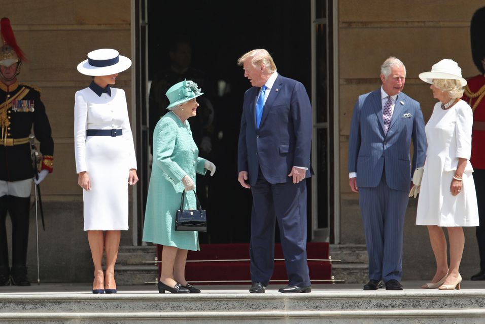 Donald Trump and his wife Melania are welcomed by the late Queen Elizabeth II, the then Prince of Wales and Duchess of Cornwall at Buckingham Palace in June 2019 (Yui Mok/PA)