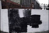 thumbnail: A mural painted over by vandals has been re-painted 