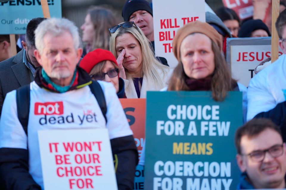 People take part in a demonstration at Old Palace Yard in Westminster to oppose the Terminally Ill Adults (End of Life) Bill. Pic:  Yui Mok/PA Wire